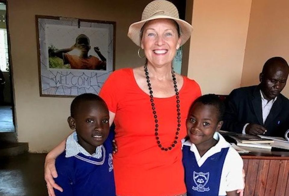 Kennedy Wilson Property Services Christine Deschaine volunteers with Bringing Hope to the Family in Uganda.