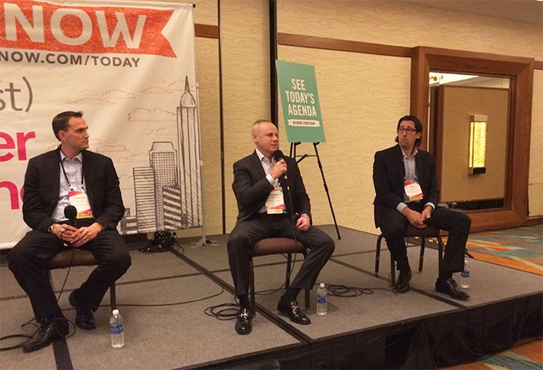 Rexford Industrial co-CEO Howard Schwimmer (center) speaks during a panel on the Orange County industrial market at a 2016 Bisnow event, between Jonathan Pharris and Brian Gagne.