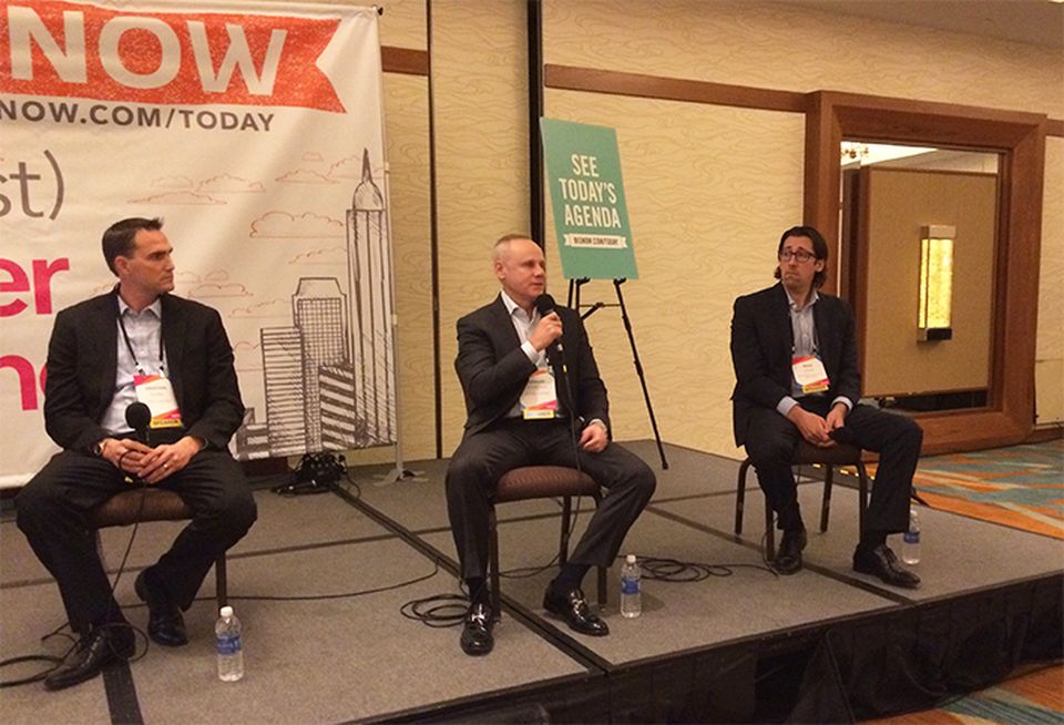 Rexford Industrial co-CEO Howard Schwimmer (center) speaks during a panel on the Orange County industrial market at a 2016 Bisnow event, between Jonathan Pharris and Brian Gagne.
