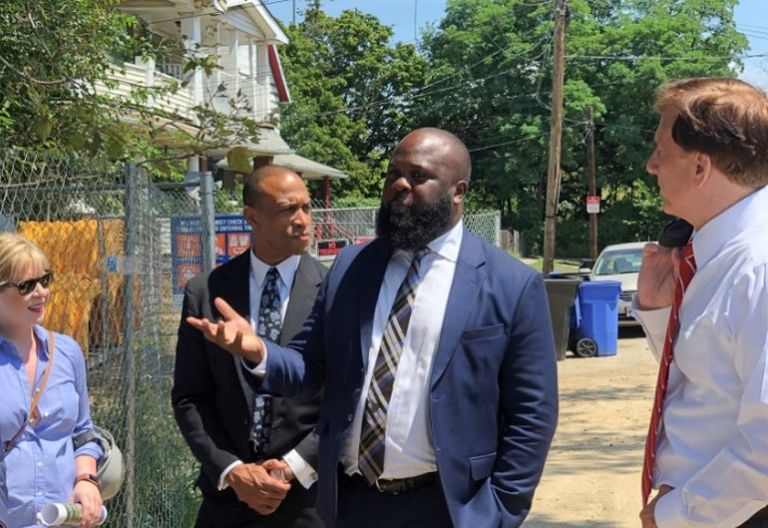 White House Opportunity and Revitalization Council Executive Director Scott Turner, Deputy Assistant to the President Ja'Ron Smith, and Assistant Secretary of Commerce for Economic Development John Fleming taking a tour of an OZ project in the Tremont neighborhood of Cleveland in 2019.