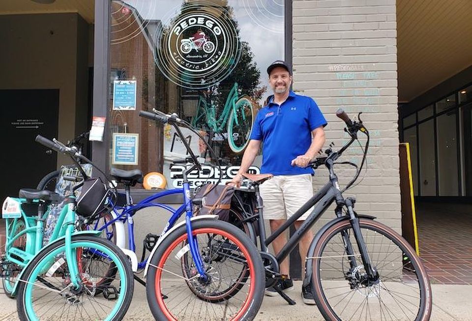 Todd Ketch, the owner of Pedego Electric Bikes' Alexandria location, in front of his Old Town store