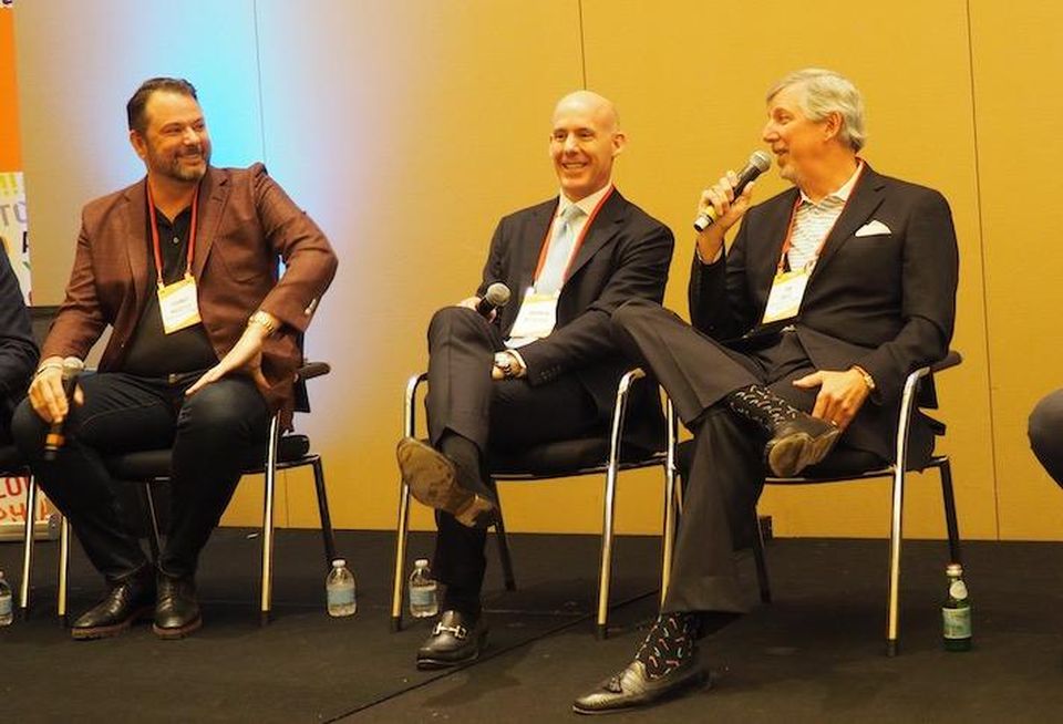 Moseley Multi-Family's Johnny Moseley, Hines' Andrew McGeorge and Jefferson Apartment Group's Jim Butz speaking at the Bisnow Multifamily Annual Conference East in December 2021.