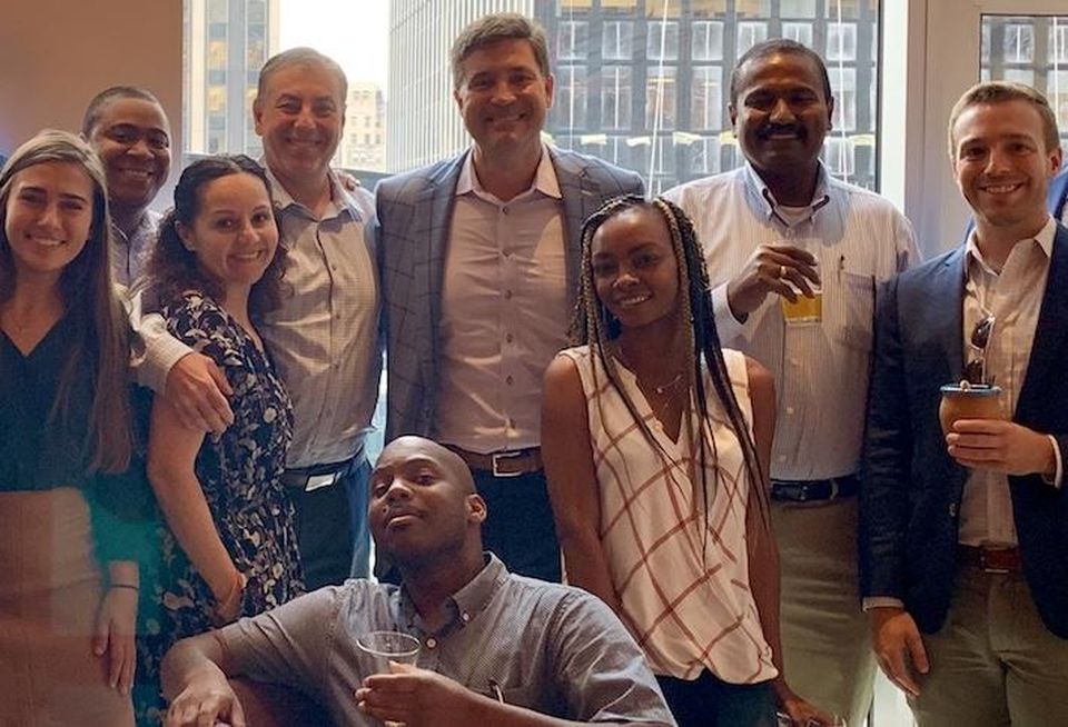 Bohler CEO Adam Volanth (back middle) with members of the company's New York City office.