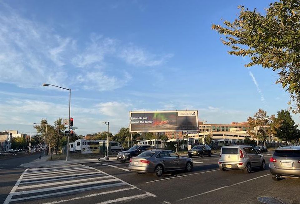 The intersection of North Capitol Street and New York Avenue NE, with the buses in the background parked on the future SEC headquarters site. 