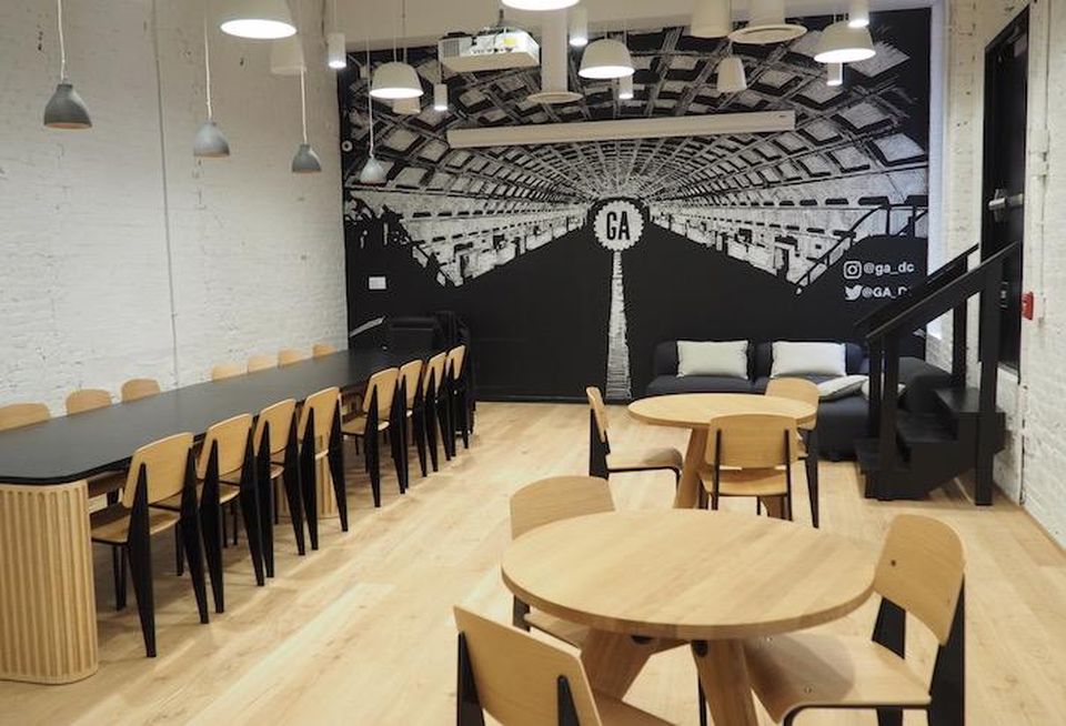 The common area with a Metro-themed mural in General Assembly's Chinatown space