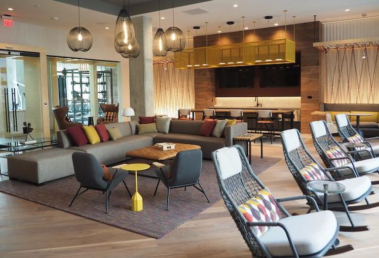 An indoor lounge amenity space at The Chase apartment building at Bryant Street. 