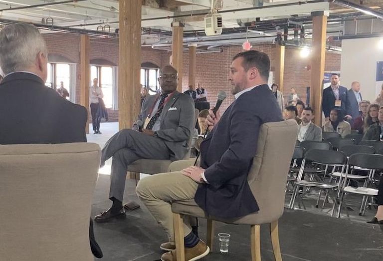 Massachusetts Life Sciences Center's Kenn Turner and MassBio's Ben Bradford at Bisnow's Boston Life Sciences Real Estate Conference.