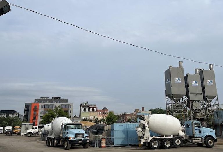The site where the new SEC headquarters is planned, photographed Tuesday June 20, is now being used as a concrete mixing plant and as a parking lot. 