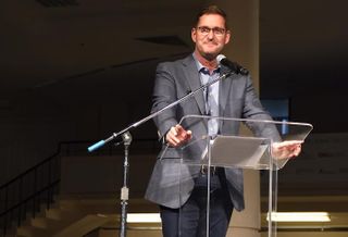 Amazon Vice President of Global Real Estate and Facilities John Schoettler speaking at a fundraising event for Seattle nonprofit Mary's Place in 2018. 