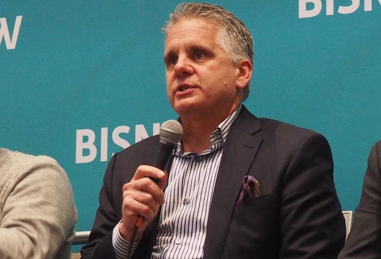 Wyndham Hotel Group Chief Development Officer Chip Ohlsson speaking at an April Bisnow event. 