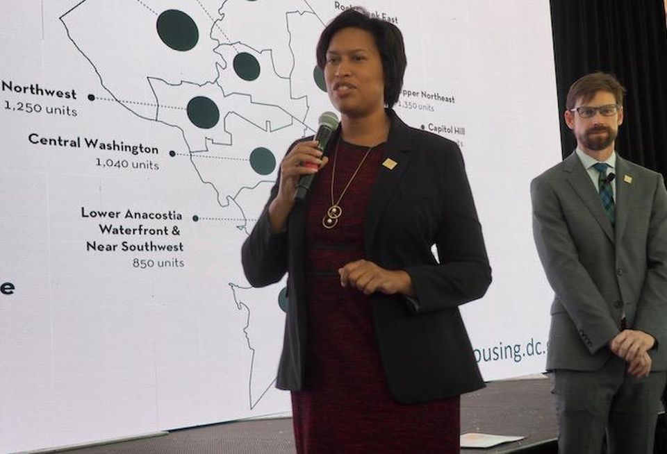 Mayor Muriel Bowser and Planning Director Andrew Trueblood presenting D.C.'s neighborhood housing targets in October 2019.