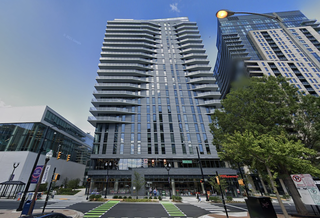 The 23-story apartment building at 1788 North Pierce St. in Arlington that Penzance delivered last year and Cortland has now acquired. 