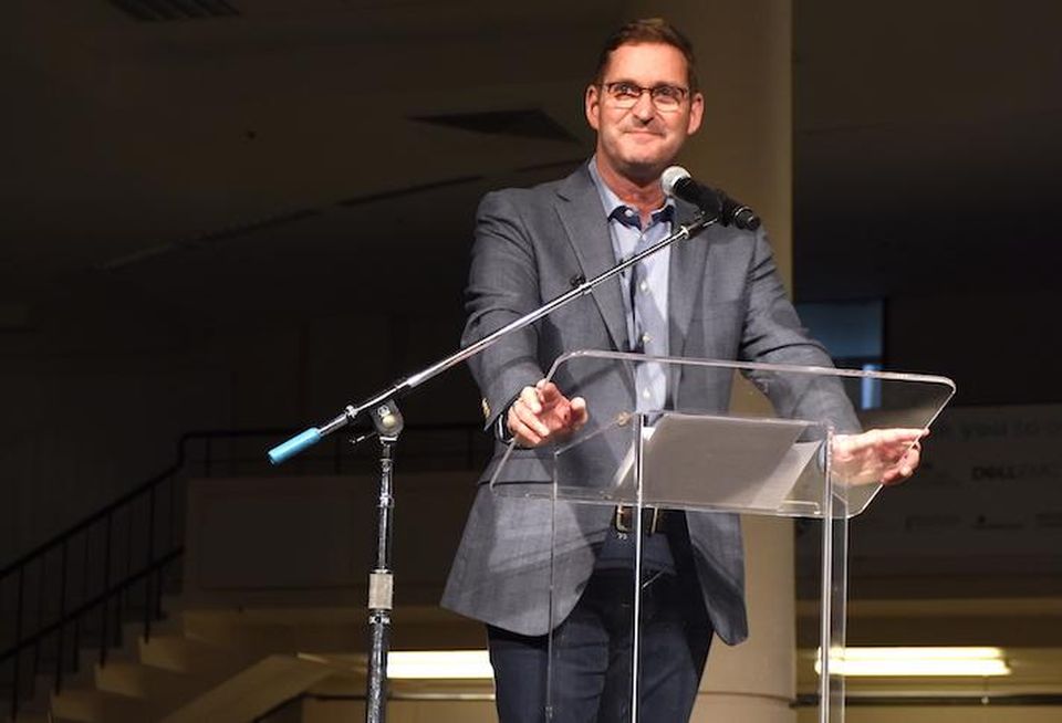 Amazon Vice President of Global Real Estate and Facilities John Schoettler speaking at a fundraising event for Seattle nonprofit Mary's Place in 2018.
