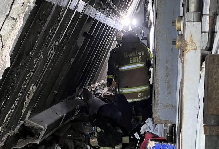 A Boston EMS worker on the site of the Boston Edison power plant after Wednesday's partial building collapse.