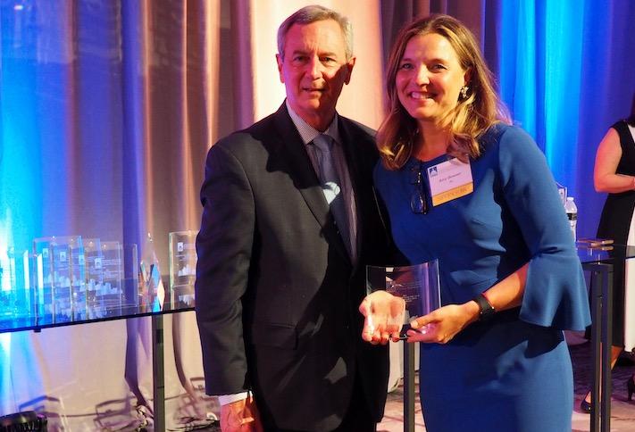 Donohoe Real Estate Services' Chris Sowick and JLL's Amy Bowser, the winner of the top D.C. leasing broker award. 