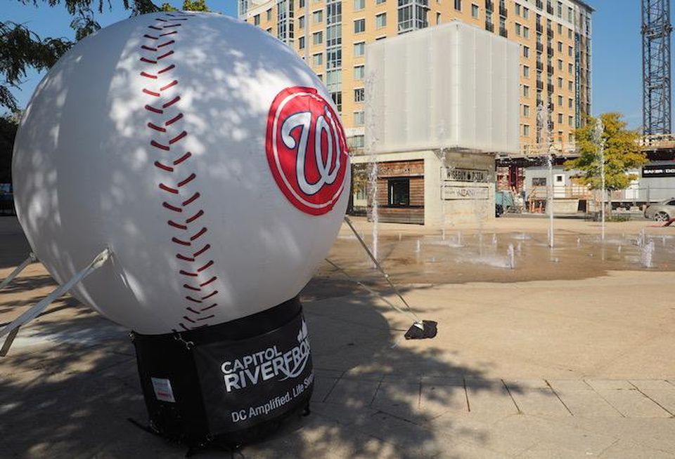 A Nationals baseball pop up in Canal Park, with the Wiseguy Pizza in the background