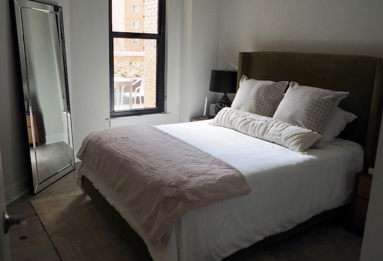 The bedroom in a model unit in the Avec building.