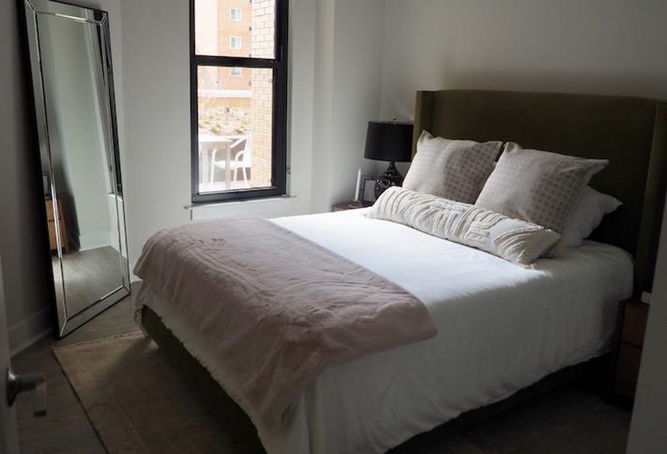 The bedroom in a model unit in the Avec building.