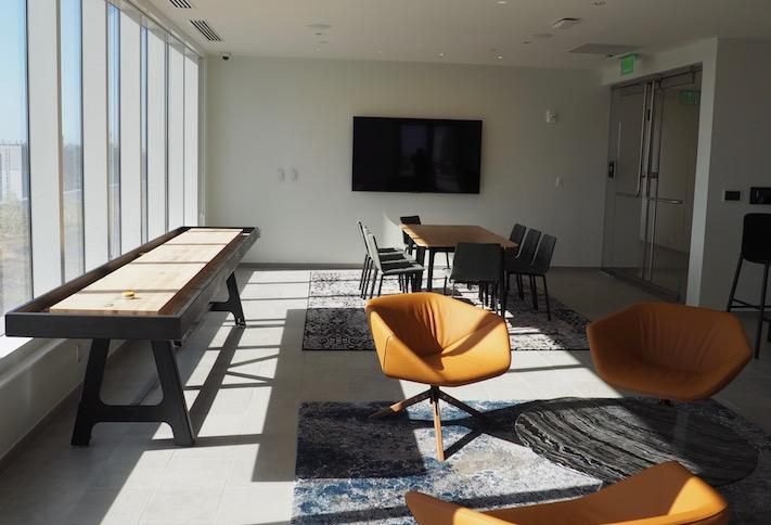 The indoor rooftop amenity space at the 909 Rose office building. 