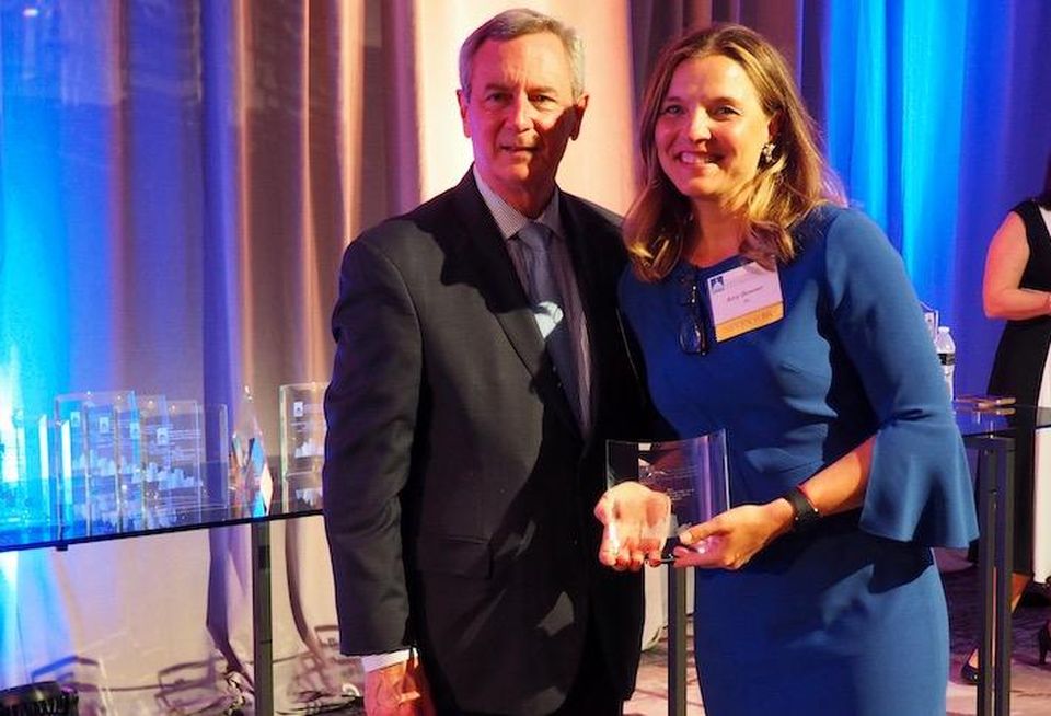 Donohoe Real Estate Services' Chris Sowick and JLL's Amy Bowser, the winner of the top D.C. leasing broker award.