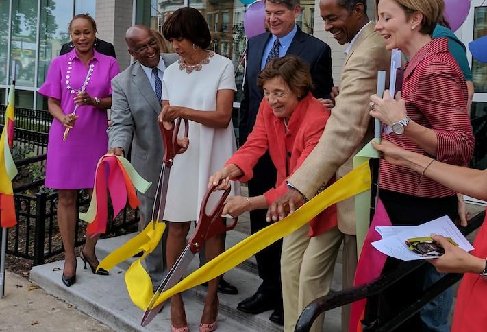 Telesis Corp. President Marilyn Melkonian cutting the ribbon on a project in Baltimore. 