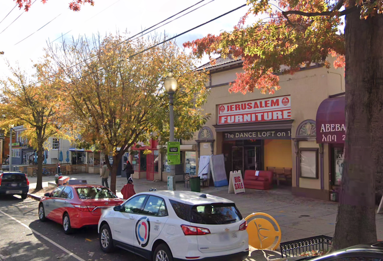 The retail property at 4618 14th St. NW, occupied by Jerusalem Furniture and The Dance Loft, with the Menkiti-owned properties to its left. 