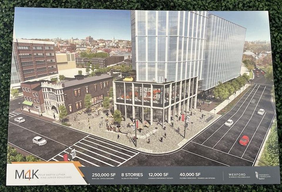 A sign at the MLK 4 groundbreaking showing a rendering of the full development.