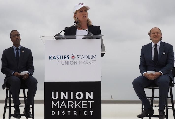 Edens CEO Jodie McLean announcing the stadium opening, flanked by Ward 5 Councilmember Kenyan McDuffie and Washington Kastles owner Mark Ein