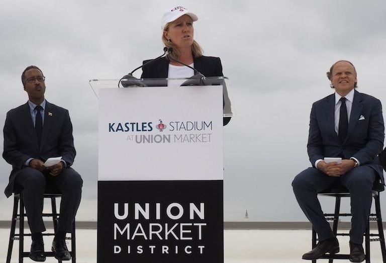 Edens CEO Jodie McLean announcing the stadium opening, flanked by Ward 5 Councilmember Kenyan McDuffie and Washington Kastles owner Mark Ein