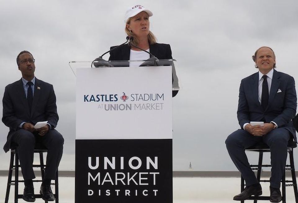 Edens CEO Jodie McLean announcing the stadium opening, flanked by Ward 5 Councilmember Kenyan McDuffie and Washington Kastles owner Mark Ein