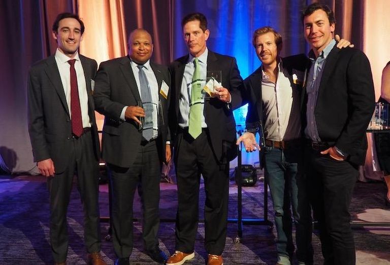 JLL's Will Donohue, Savills' Todd Valentine, JLL's Brian Sullivan Douglas Development's Matthew Jemal and Douglas Development's Drew Turner accepting the award for D.C. Leasing Transaction of the Year. 