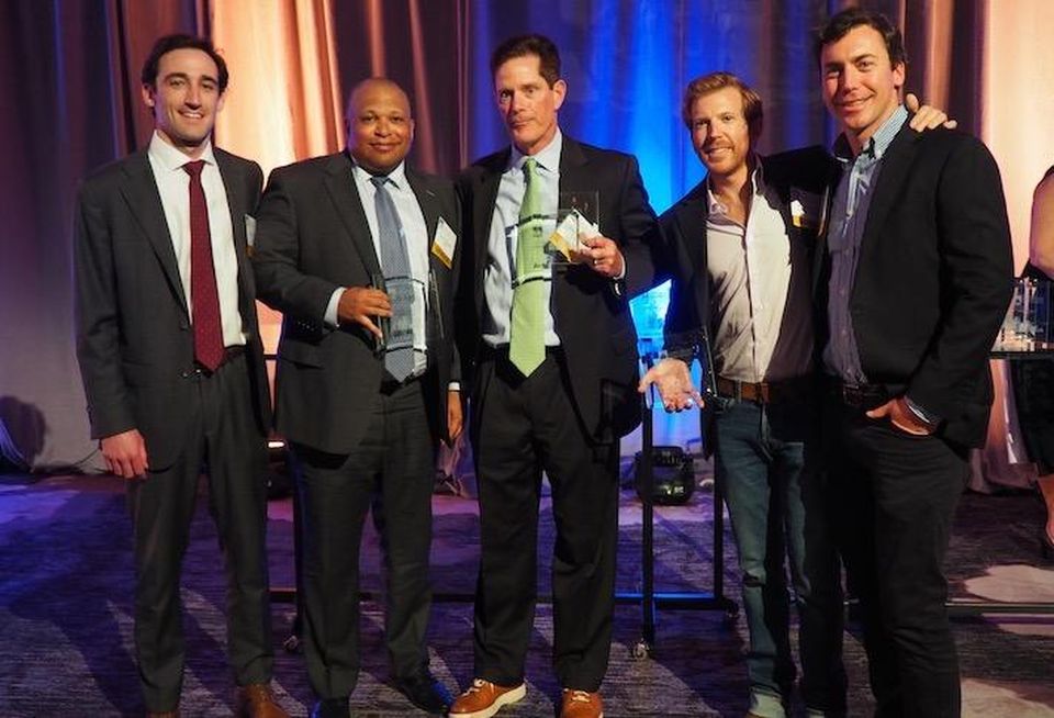 JLL's Will Donohue, Savills' Todd Valentine, JLL's Brian Sullivan Douglas Development's Matthew Jemal and Douglas Development's Drew Turner accepting the award for D.C. Leasing Transaction of the Year.