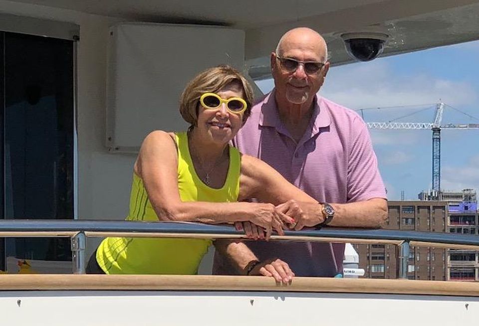 Fred Ezra and his wife, Starr, on his yacht