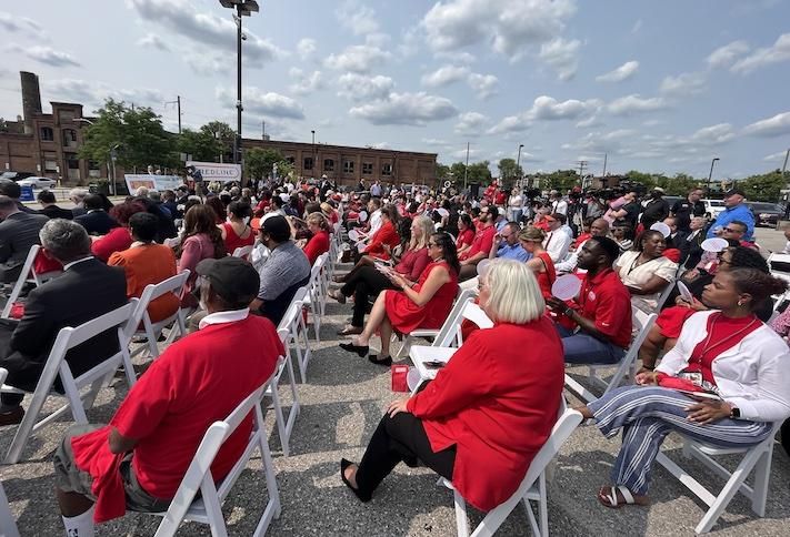 The large crowd at Moore's event wearing red to support the revival of the Red Line project. 