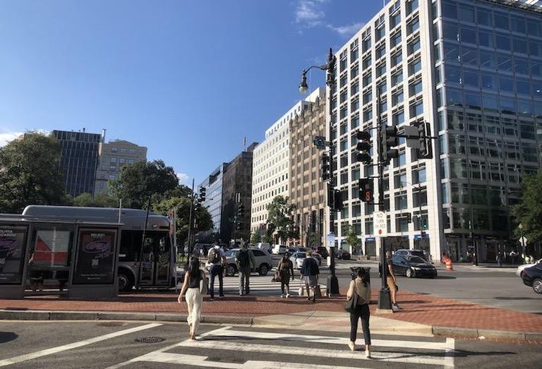 Pedestrians crossing Downtown D.C's 17th and K street NW intersection Tuesday morning. 