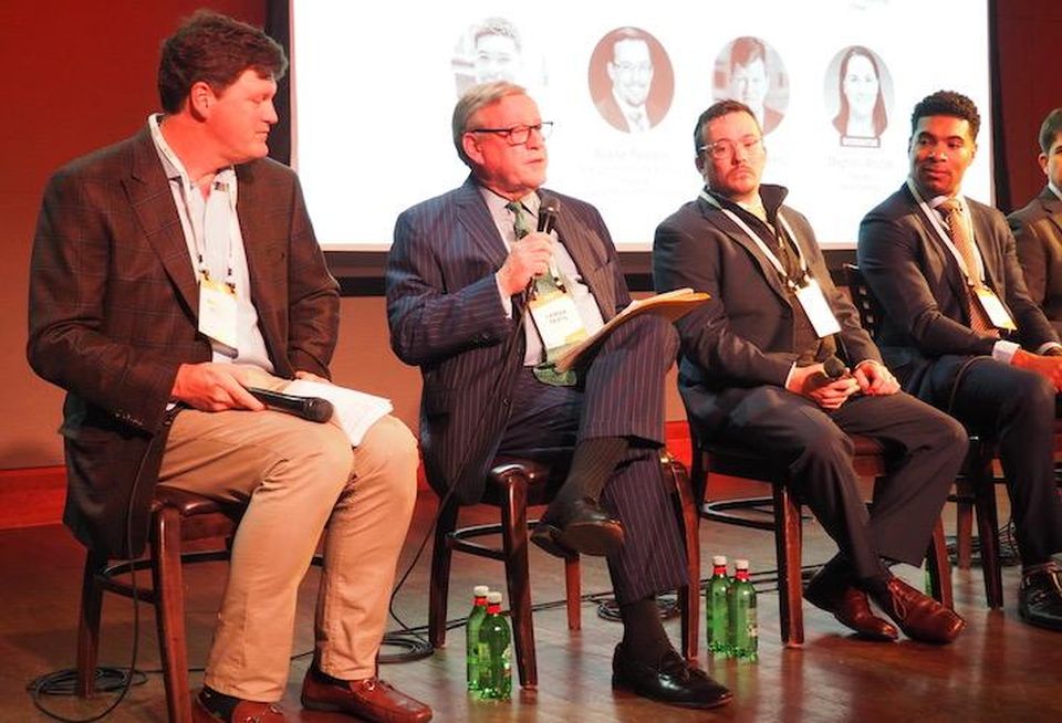 Greystone's Lamar Seats (second from left), then Deputy Assistant Secretary at HUD, speaking at a 2019 Bisnow event.