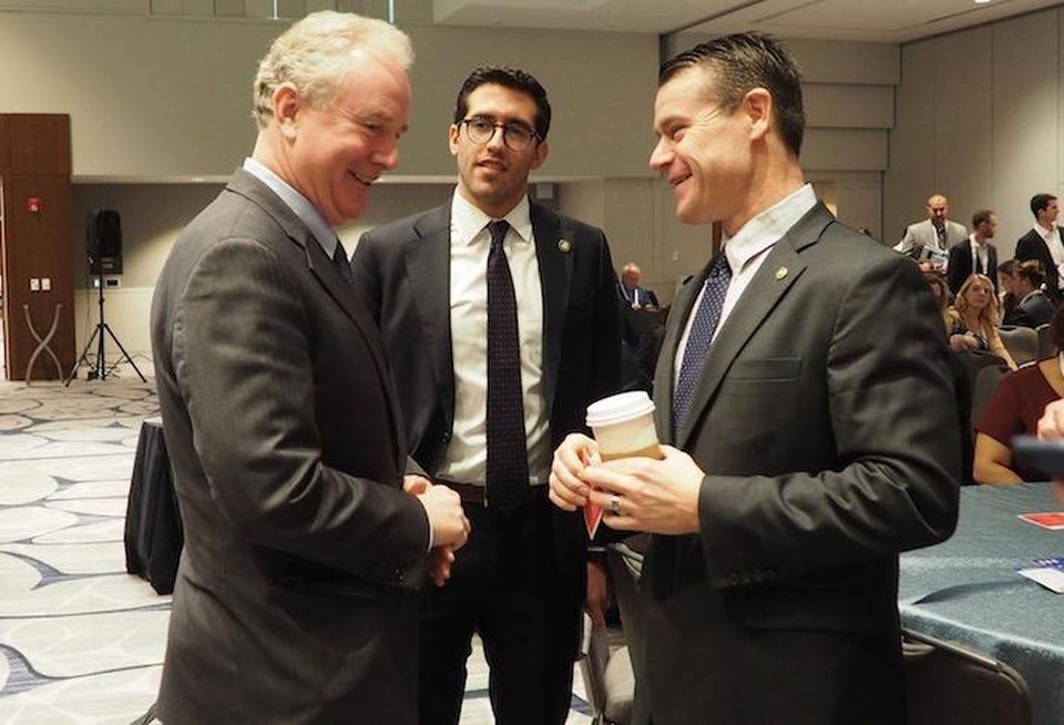 Sen. Chris Van Hollen, HUD Deputy Chief of Staff Alfonso Costa and Sen. Todd Young speaking before a Bisnow panel