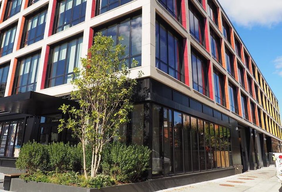 The Liz development's facade features rainbow tiles, a nod to Whitman Walker's mission to serve the LGBTQ community