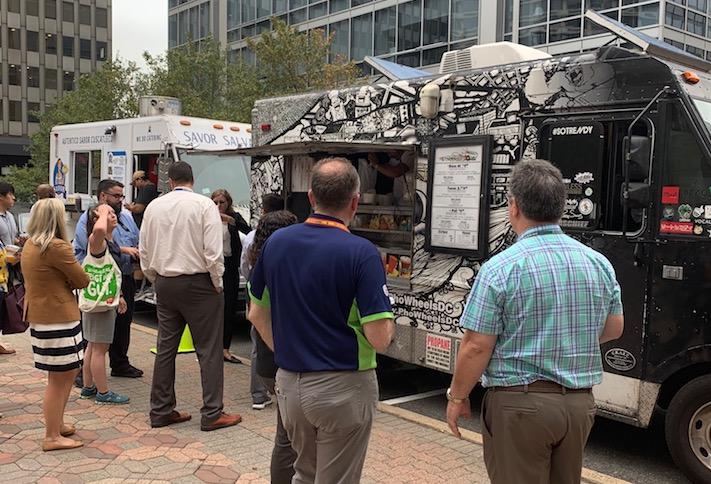 Customers at Food Truck Thursdays, a partnership between Curbside Kitchen, the Crystal City BID and JBG Smith