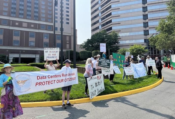 Northern Virginia data center opponents protesting outside of Bisnow's DICE East event in Tysons last month. 