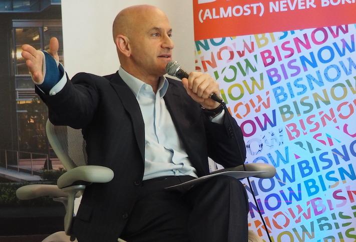 Mitchell Schear speaking at a 2018 Bisnow event