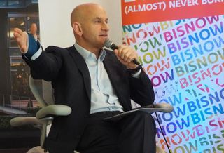 Mitchell Schear speaking at a 2018 Bisnow event