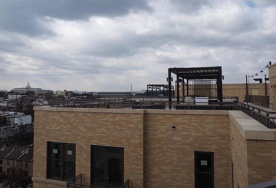 The rooftop courtyard and view of the U.S. Capitol atop the Avec building on H Street.