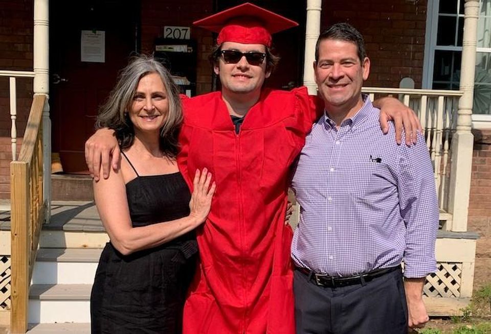 Building Engines CEO Tim Curran (right) with his wife and son.