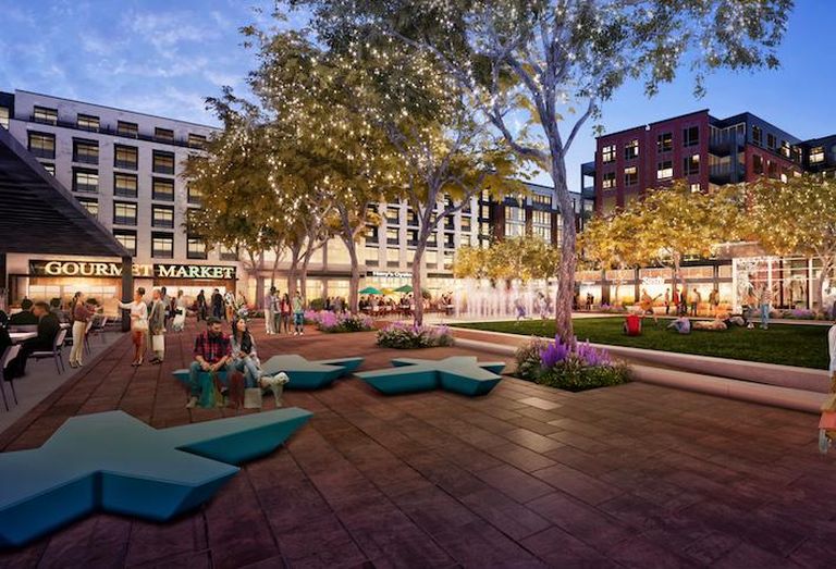 A rendering of the central plaza in the Parks at Walter Reed development, with the grocery store on the left