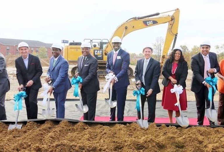 Frontier Development & Hospitality CEO Evens Charles (center) celebrating the groundbreaking of a project in Maryland. 