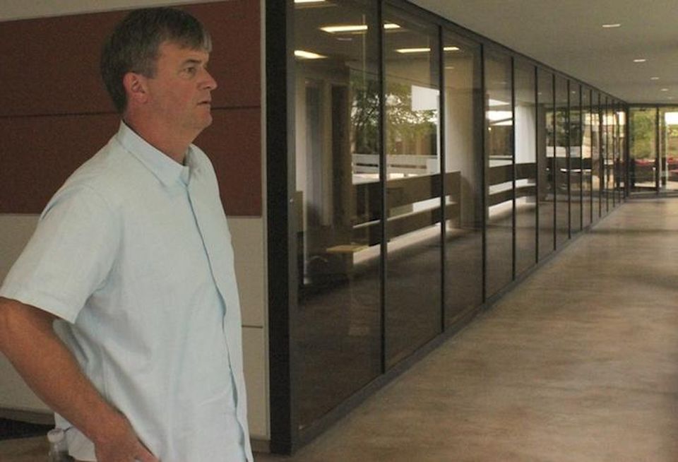 The Ardent Cos. Managing Director Mike Guynn looking out over the courtyard from Piedmont Center I in Buckhead in Atlanta.