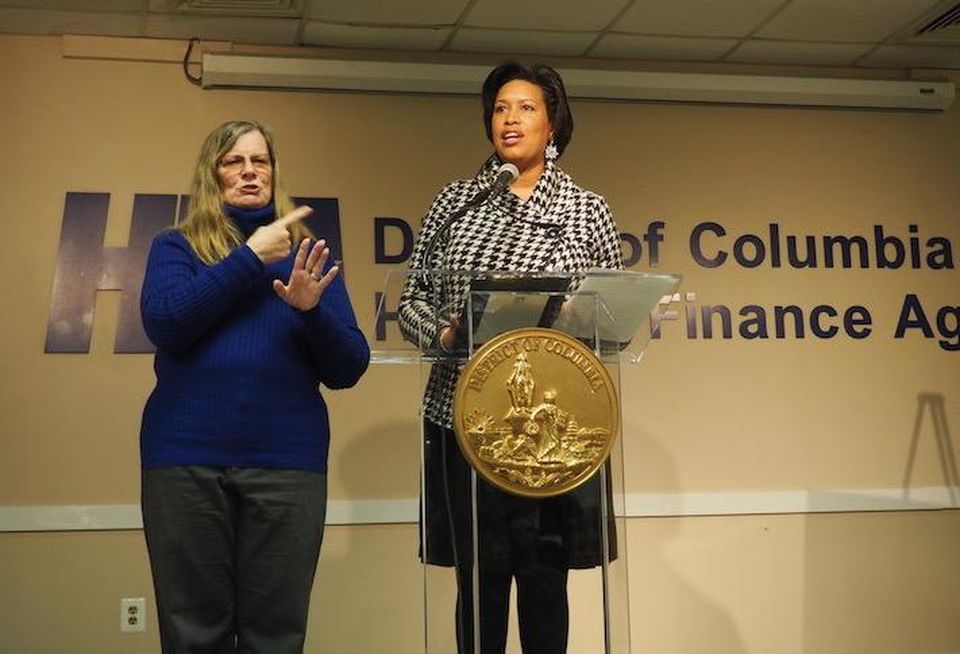 Mayor Muriel Bowser speaking at the New Year New Housing event Jan. 17, with a sign language interpreter on the left.