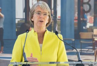 Caroline Moore, a senior vice president at Wexford Science & Technology speaks at the ceremonial ground breaking for 4MLK.