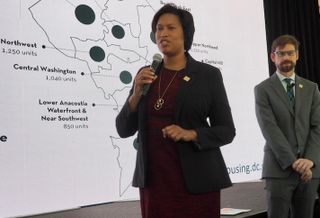 Mayor Muriel Bowser and Planning Director Andrew Trueblood presenting D.C.'s neighborhood housing targets in October 2019.